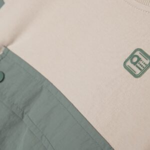 Pull beige poche verte