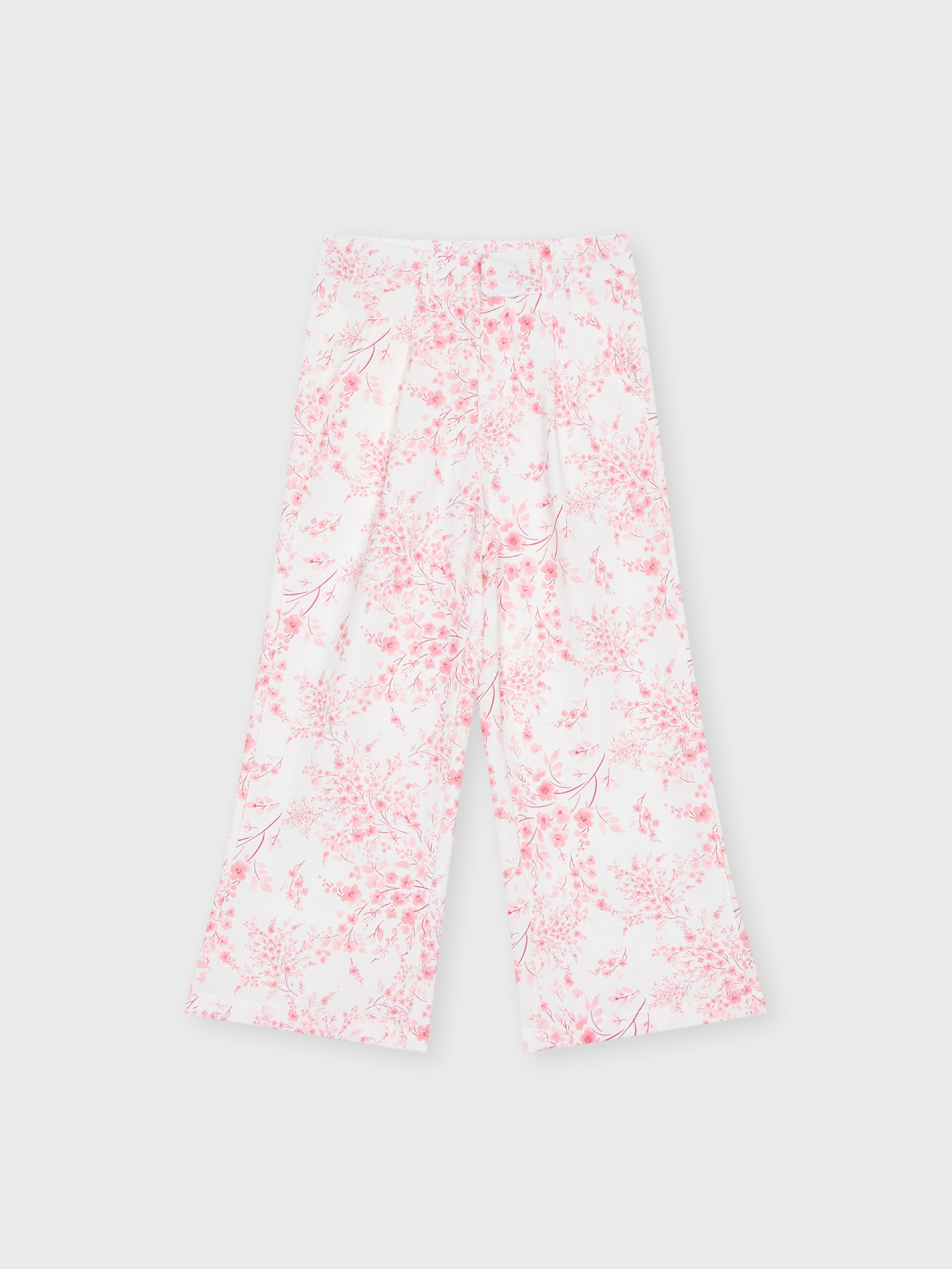 Pantalon blanc à fleurs roses, léger et agréable à porter, pour filles et ados, boutique de vêtements pour enfants à Saint Martin en Haut, dans les Monts du Lyonnais.